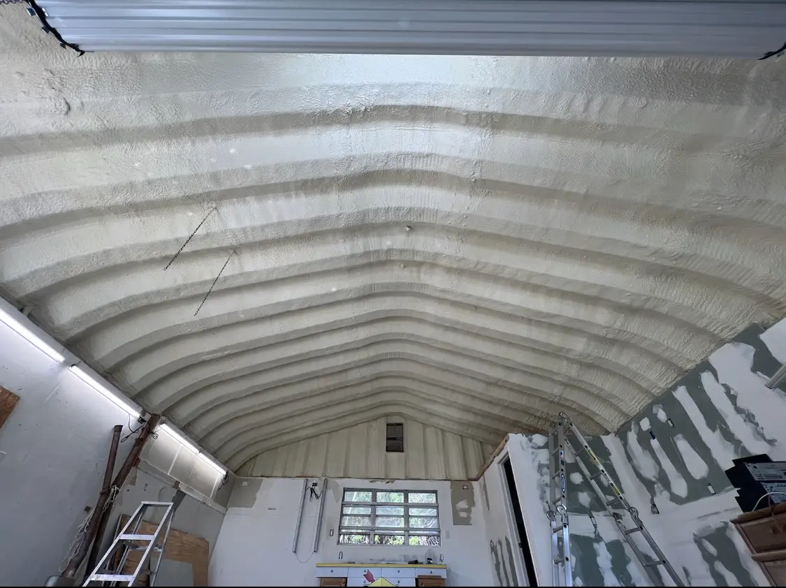 Spray polyurethane foam applied to the underside of a metal roof deck in Cranston
